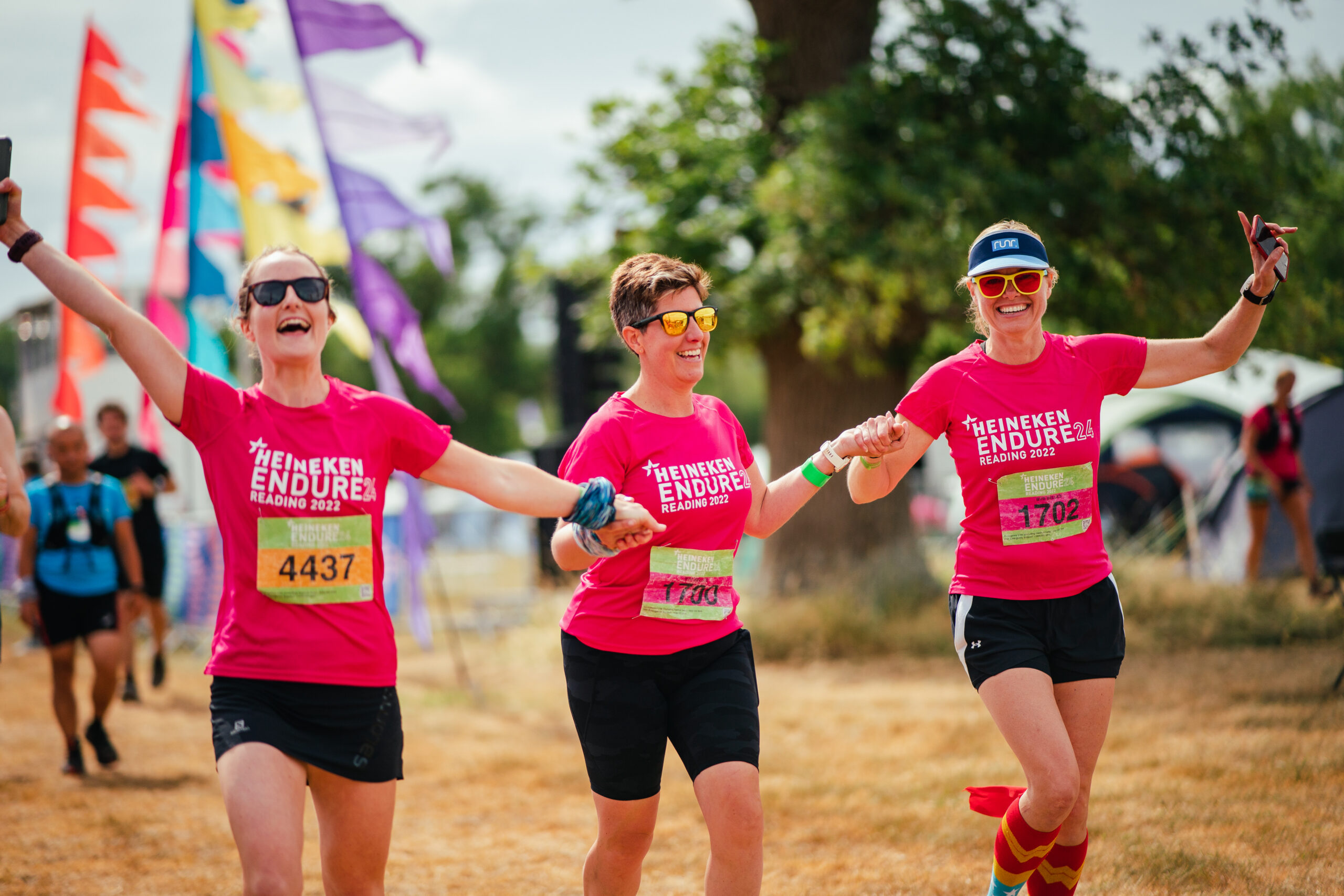 3 ladies celebrate success at a 24 hour relay